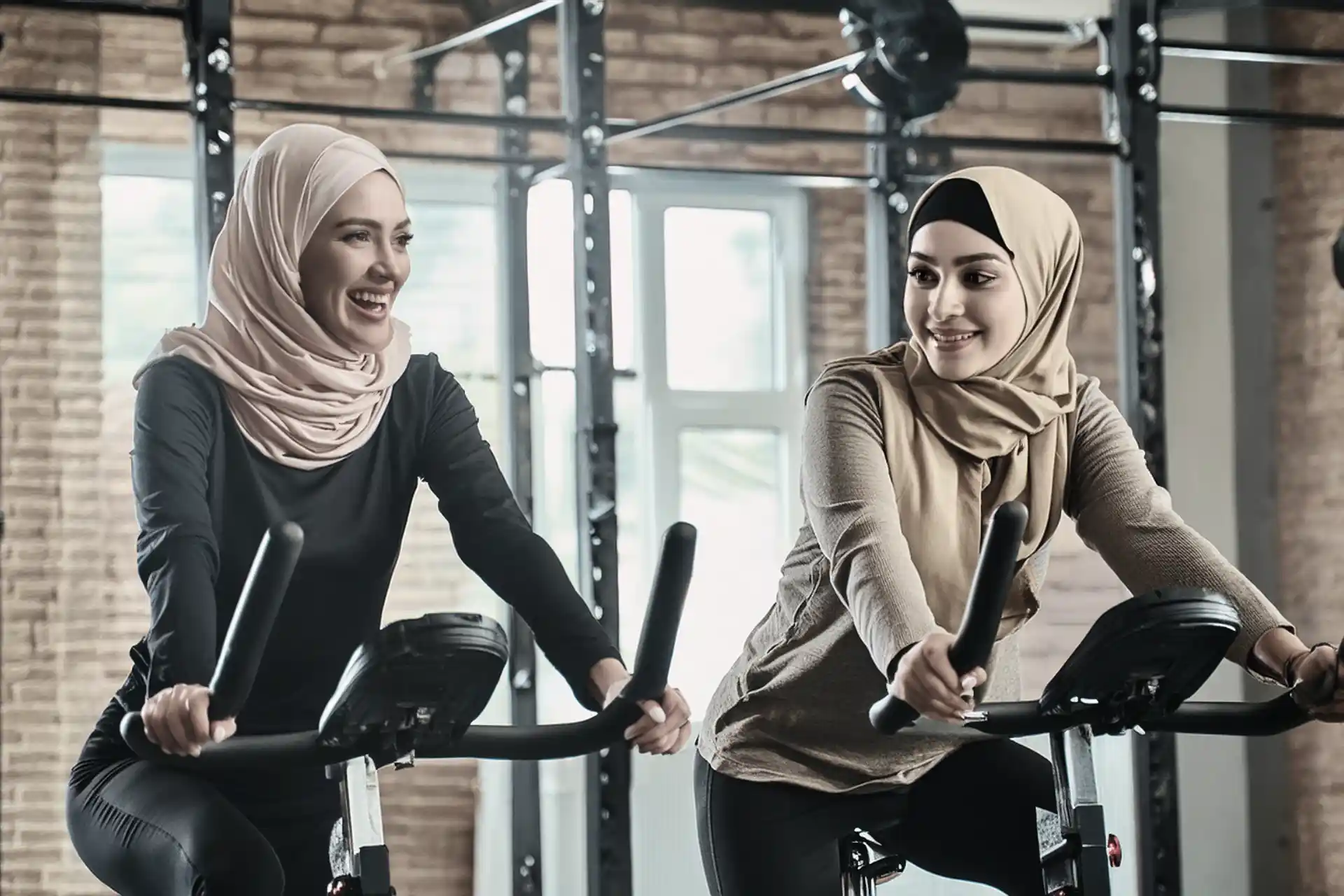 Women in hijab doing some bike training in the fitness centre